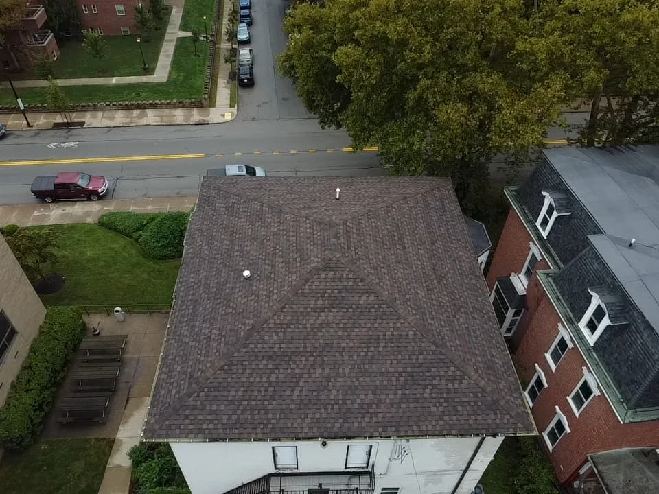 Overhead view of a completed hip roof in architectural shingles